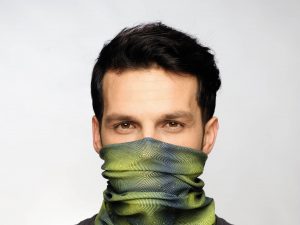 Cropped studio image. Man wearing a face mask. credit - 2011 copyright Original Buff S.A
