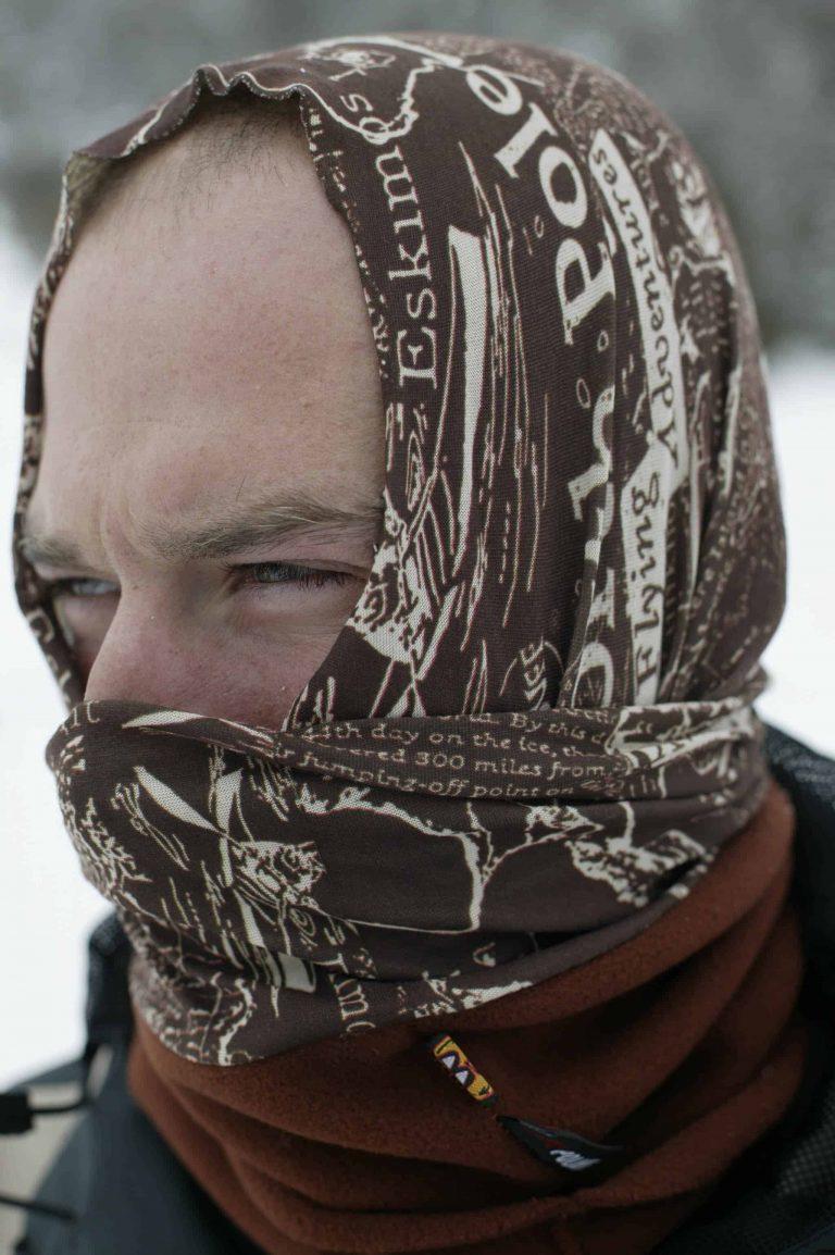 A portrait shot of a man wearing a Polar Buff® as a balaclava. It looks cold and he has the face mask part on in 2 layers. It's also obvious that he has very little hair. Source: buff.eu. Distributed for the promotion of the Polar Buff®.
