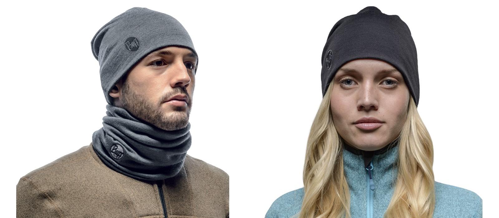 A montage of two studio shots. On the left is a male model wearing a solid grey Heavyweight Merino Wool Loose Hat and a Thermal Neckwarmer Buff®. On the right is a female model wearing a solid black Heavyweight Merino Wool Loose Hat. Source: Buff.eu