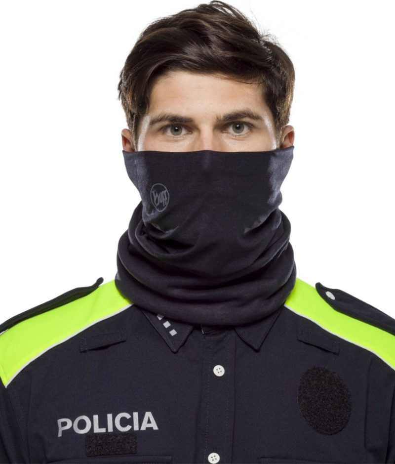 Studio photo of the Cut+Fire Resistant BUFF® Design "Solid Paris Blue” worn by a police officer as face mask. Source: buff.eu