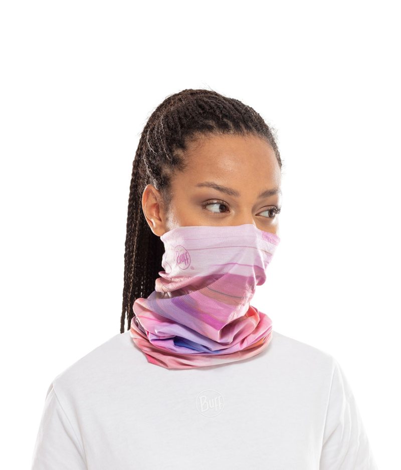 Studio photo of a Woman wearing the BUFF® Coolnet UV+ Design "NE10 Pale Pink”. Source: buff.eu