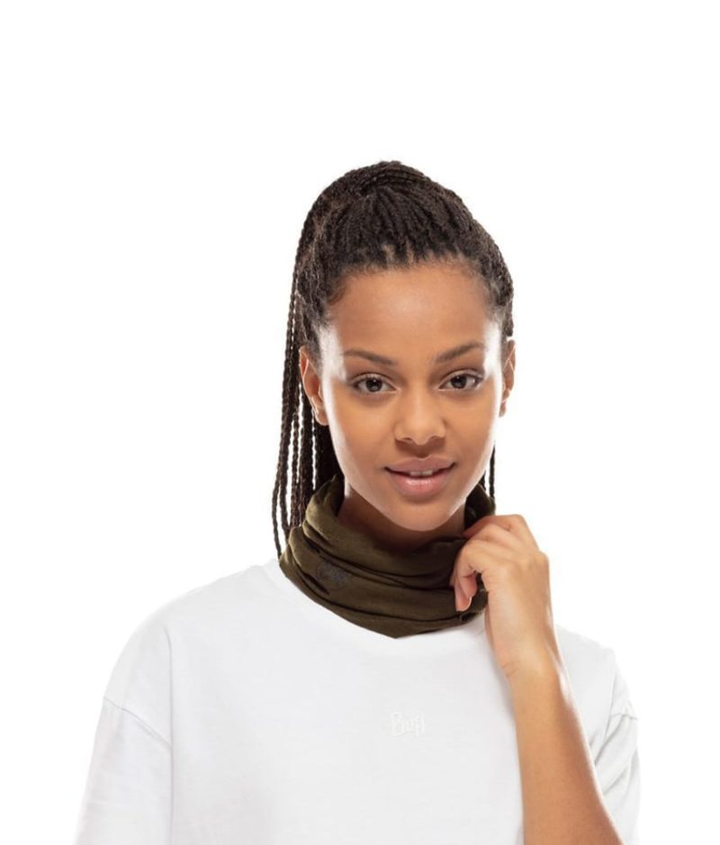 Studio photo of a Woman wearing the BUFF® Coolnet UV+ Insectshield™ Design "Solid Military” as a neck cooler. Source: buff.eu