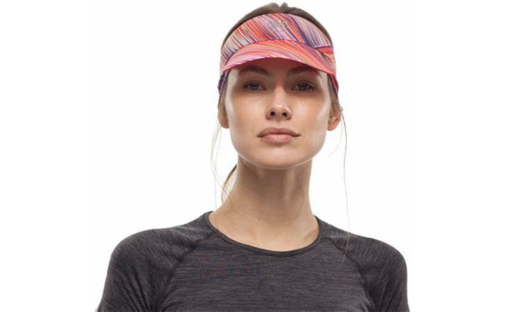 Studio photo of a woman wearing a BUFF® Pack Run Visor as a sun shade. Source: buff.eu