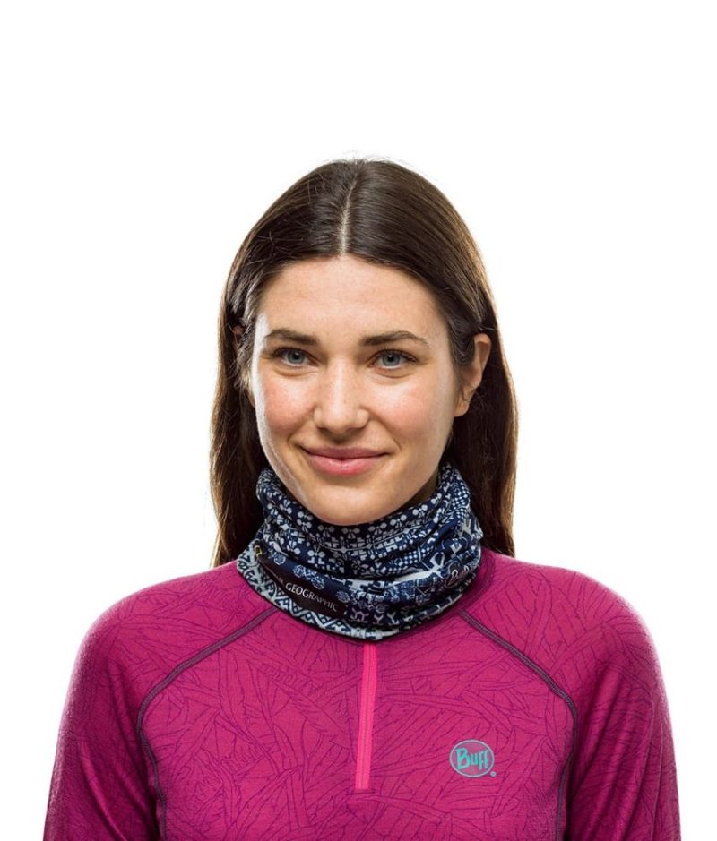 Studio photo of a Woman wearing the BUFF® Original Multifunctional Headwear Design National Geographic Collection "Kurzeme Dark Navy” as a neckwarmer. Source: buff.eu