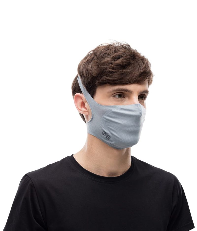 Studio photo of a Man wearing the BUFF® Filter Face Mask Design "Galactic Grey”. Source: buff.eu