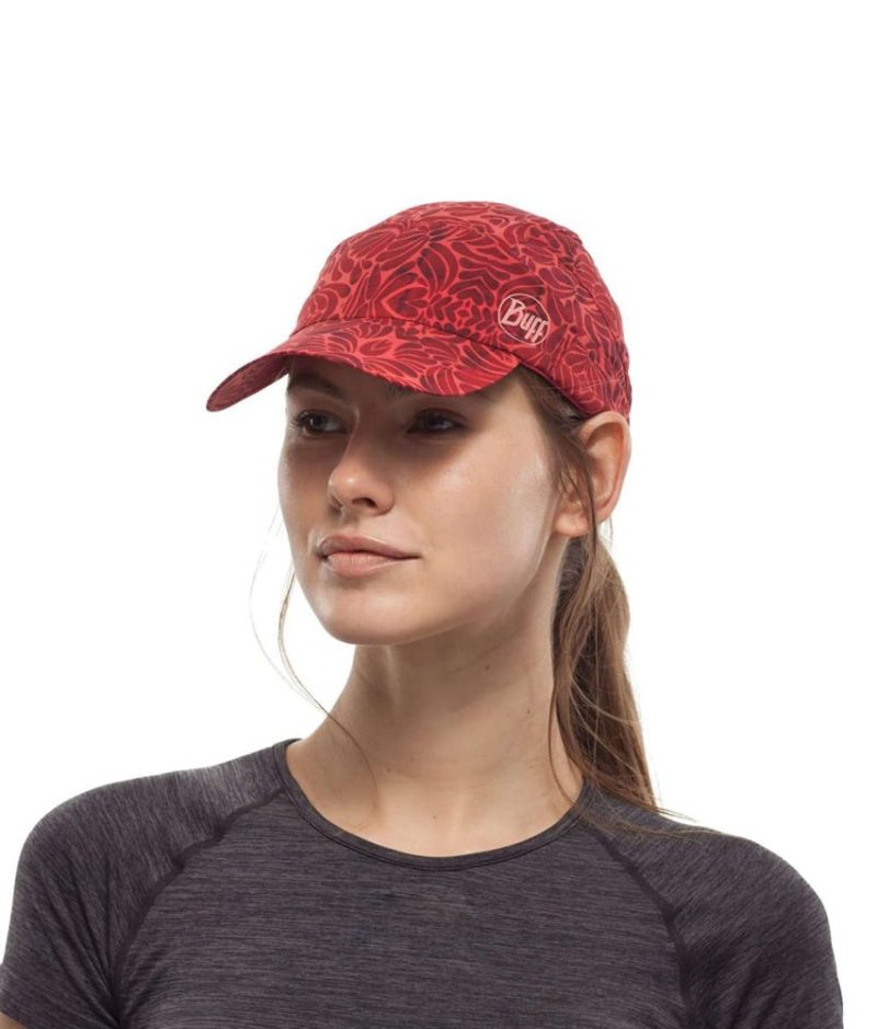 Studio photo of a Woman wearing the BUFF® Pack Treck Cap Design ”Calyx Grenadine”. Source: buff.eu