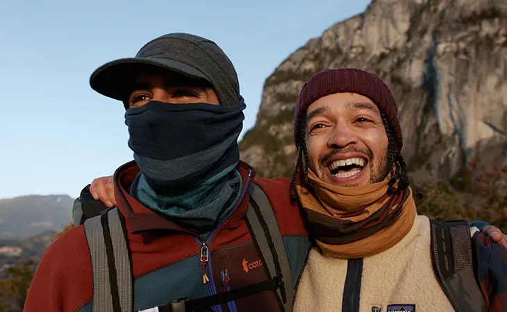 2 men enjoying a cold clear day in the mountains wearing the BUFF® Merino Move. Source: buff.eu